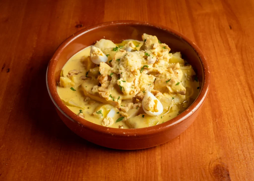 Ají de pollo con nueces y parmesano de Tasca Picona